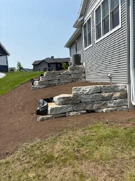 Transform Your Yard with Expert Retaining Wall Services image